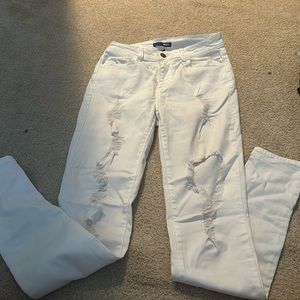 Super soft and stretchy white ripped jeans from fashion nova